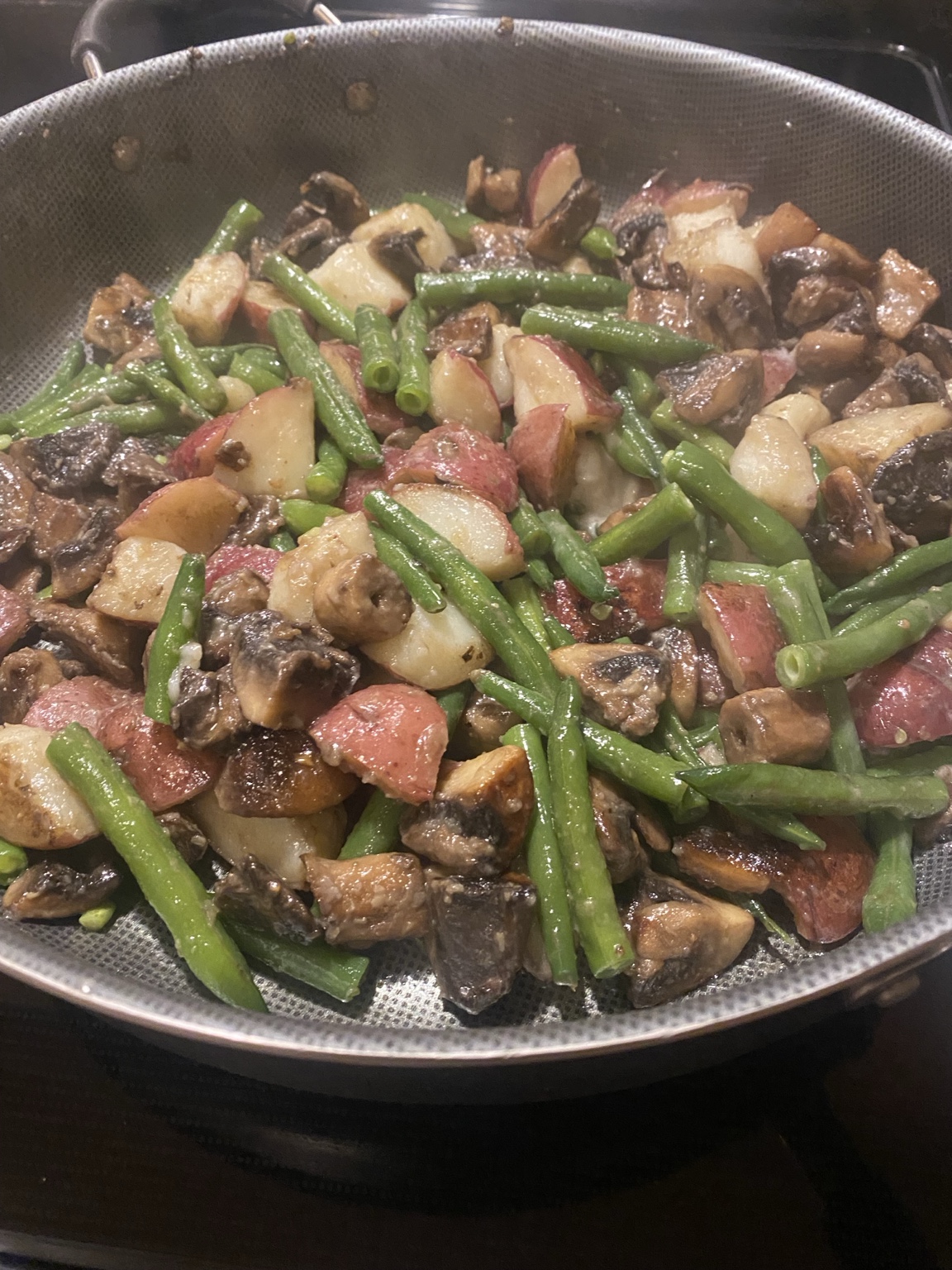 Roasted potatoes, green beans, and mushrooms prepared by Gaetano Mazza